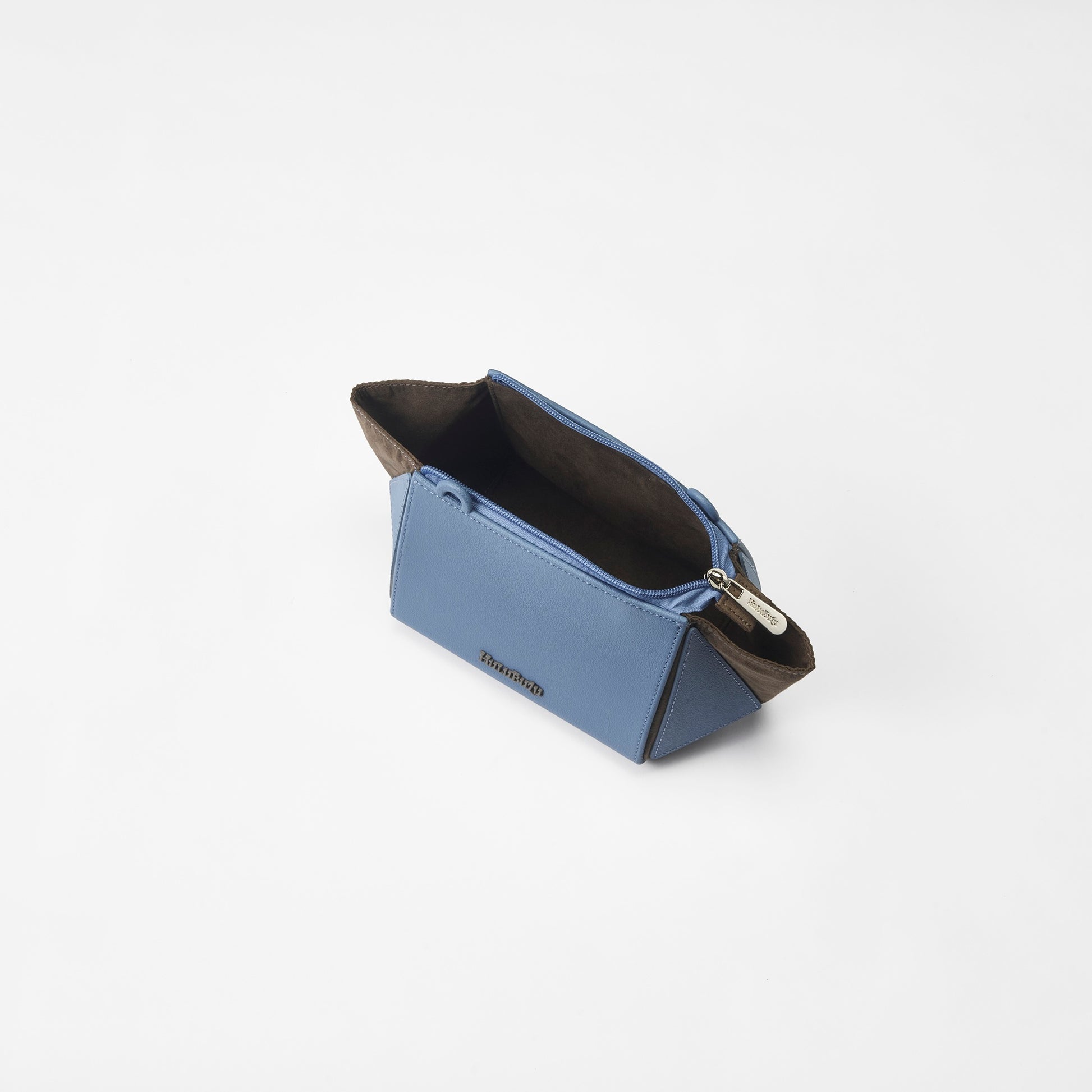 Interior view of HuluBulu Aqua Blue In & Out Crossbody Bag - Wide opening with zipper and spacious brown suede-like lining for easy access.